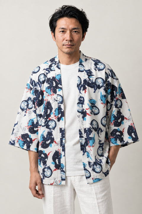 White Floral Kimono Cardigan 'Hanazono' – white Japanese kimono cardigan with blue and navy floral print, unisex haori style jacket, front view on model
