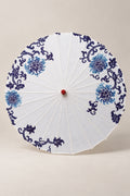 White Japanese Parasol 'Aohana' – white parasol printed with blue peonies and scrolls in blue-and-white porcelain style, Japanese wagasa parasol with wooden frame and paper-effect canopy, open, studio view