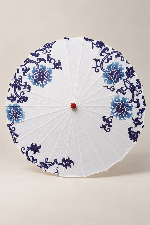 White Japanese Parasol 'Aohana' – white parasol printed with blue peonies and scrolls in blue-and-white porcelain style, Japanese wagasa parasol with wooden frame and paper-effect canopy, open, studio view