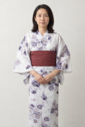 White Peony Kimono 'Shion' – white women's kimono with purple peony print and dark red obi belt, traditional Japanese yukata, front view on model