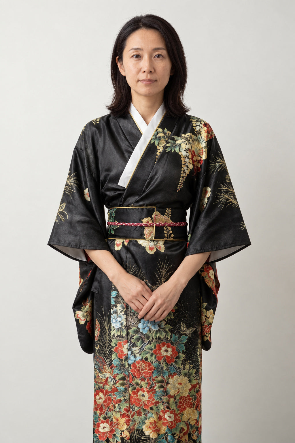 Women's Black Wisteria Kimono 'Fujinami' – black women's kimono with wisteria and floral print, white collar and patterned obi, long Japanese kimono robe, front view on model