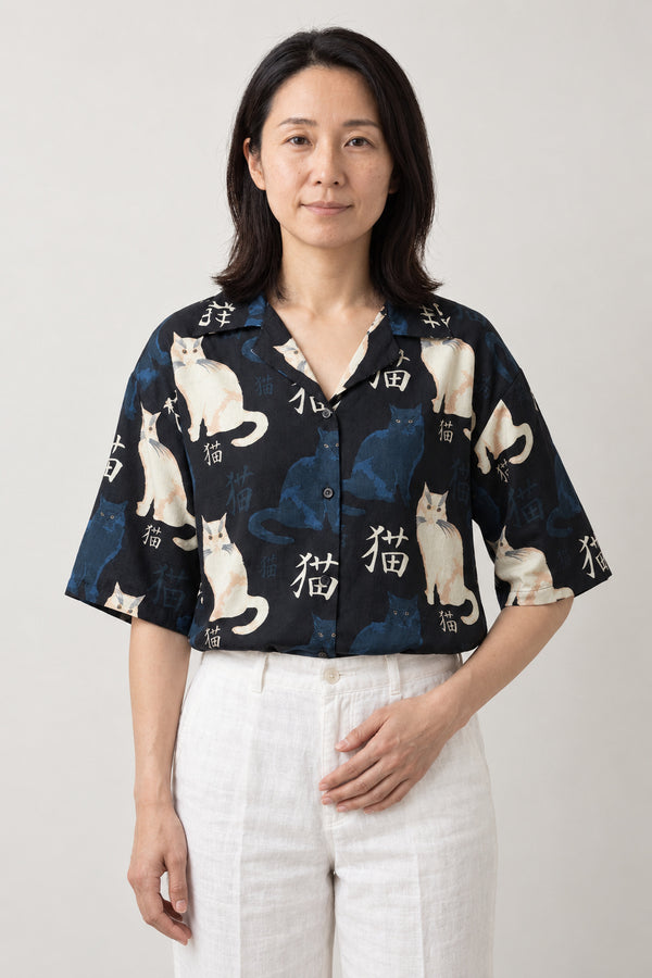 Women's Cat Print Camp Shirt 'Nekomachi' – navy women's camp collar shirt with white cat and kanji print, Japanese cat blouse, front view on model