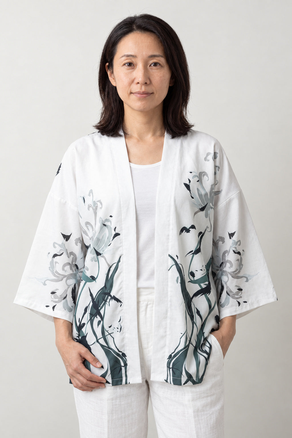 Women's Ink Crane Kimono Jacket 'Ashiwara' – white women's kimono jacket with ink-painted cranes and reeds print, Japanese haori style cardigan, front view on model