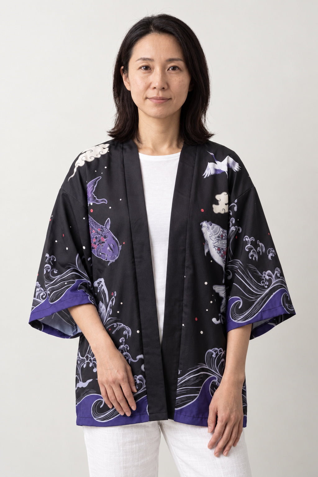 Women's Koi Kimono Jacket 'Murasaki' – black and purple women's kimono jacket with koi carp, waves and red sun print, Japanese haori style cardigan, front view on model