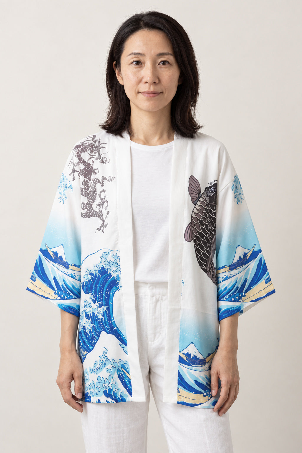 Women's Koi Wave Kimono Blouse 'Noborigoi' – white women's kimono blouse with koi carp and great wave print, Japanese haori style top, front view on model