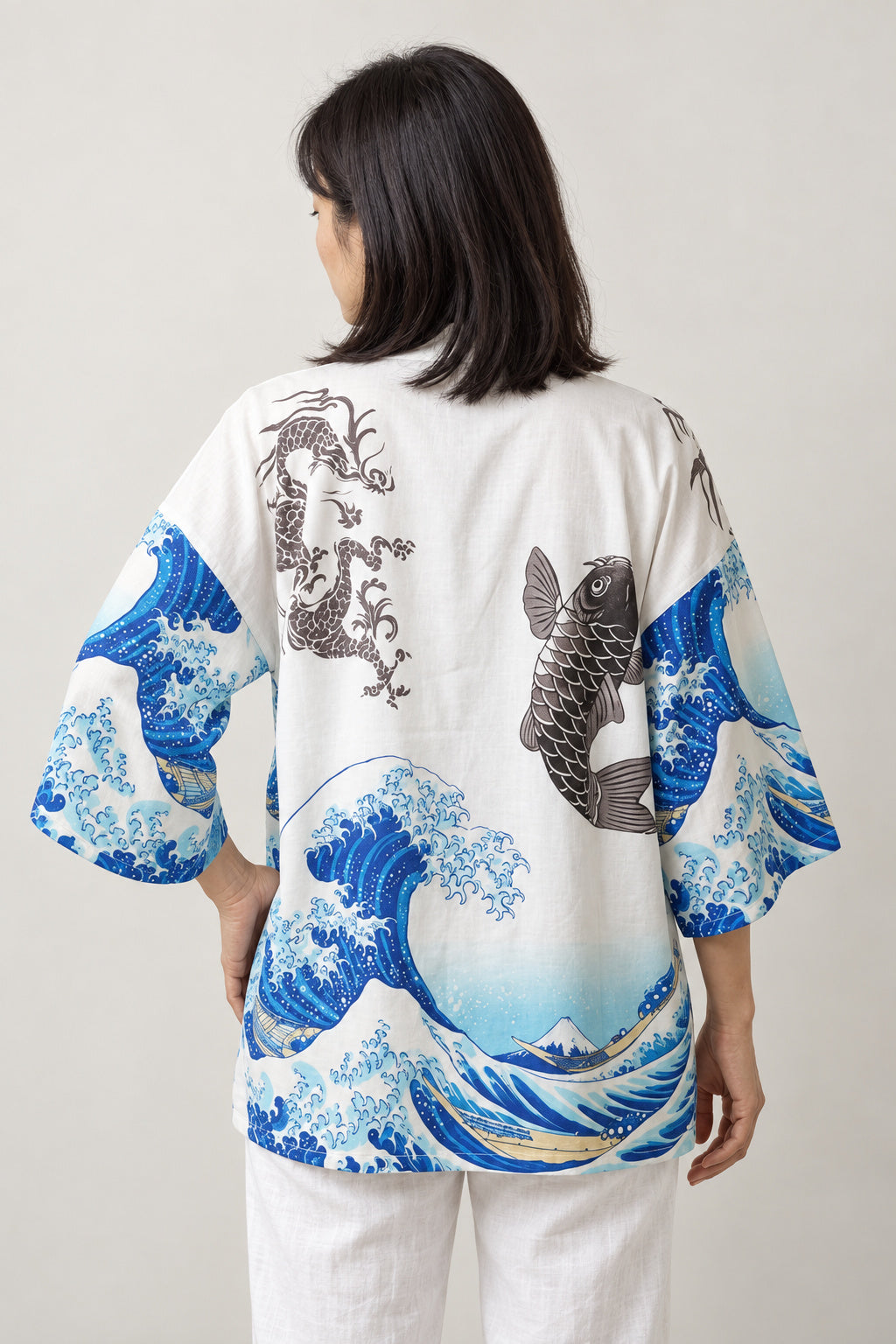 Women's Koi Wave Kimono Blouse 'Noborigoi' – back view of white kimono blouse showing koi fish leaping over a great wave
