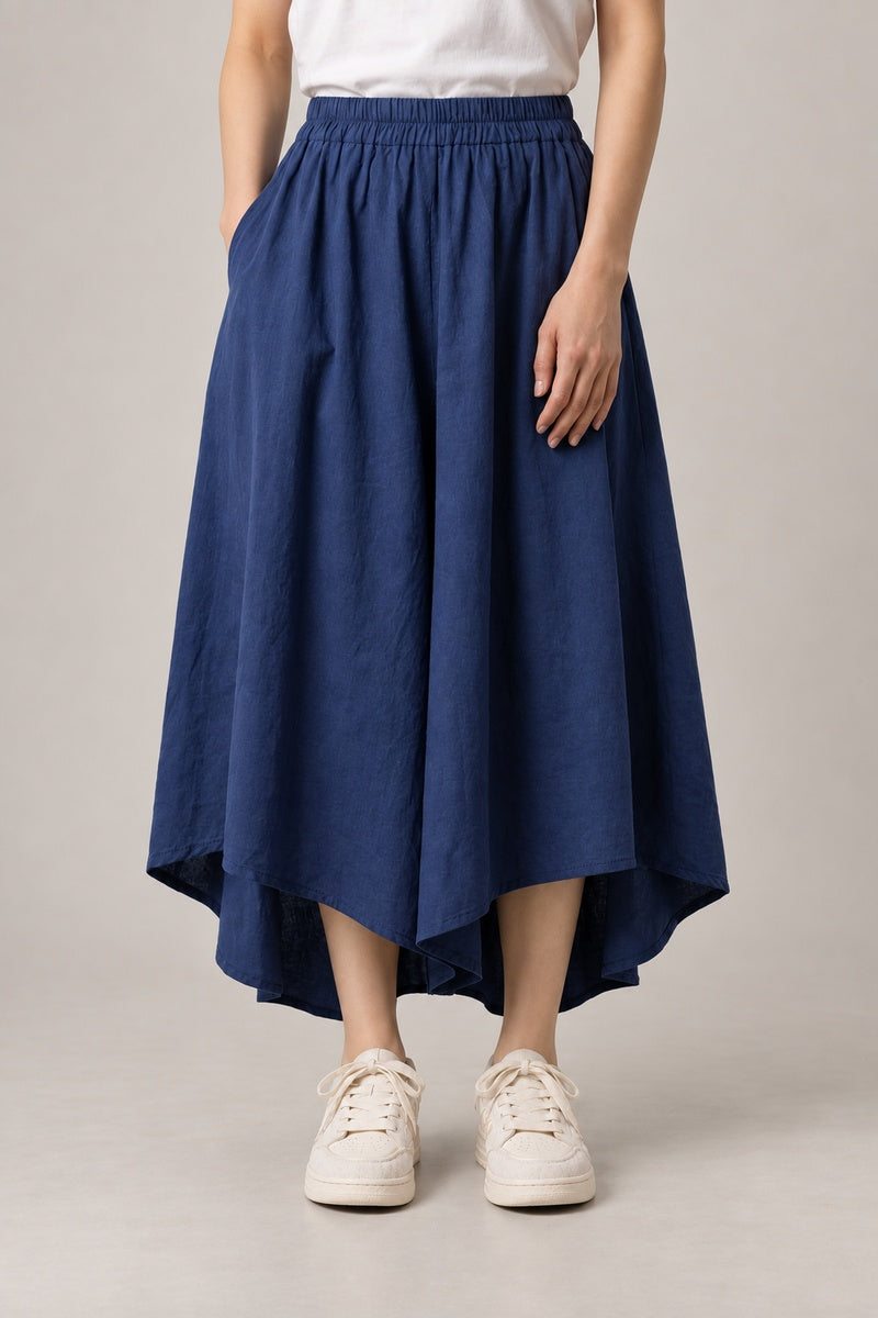 Women's Navy Pocket Hakama Skirt 'Konai' – navy blue midi hakama skirt with pockets and elastic waist, women's Japanese style skirt, front view on model