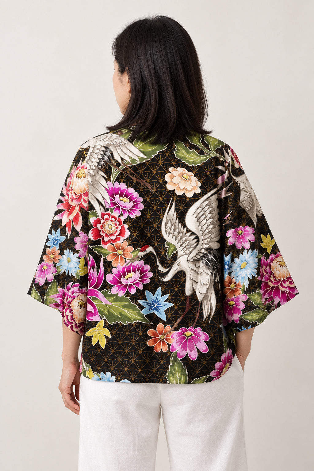 Women's Peony Haori Jacket 'Hyakka' – back view of black women's haori showing the all-over peony and crane print