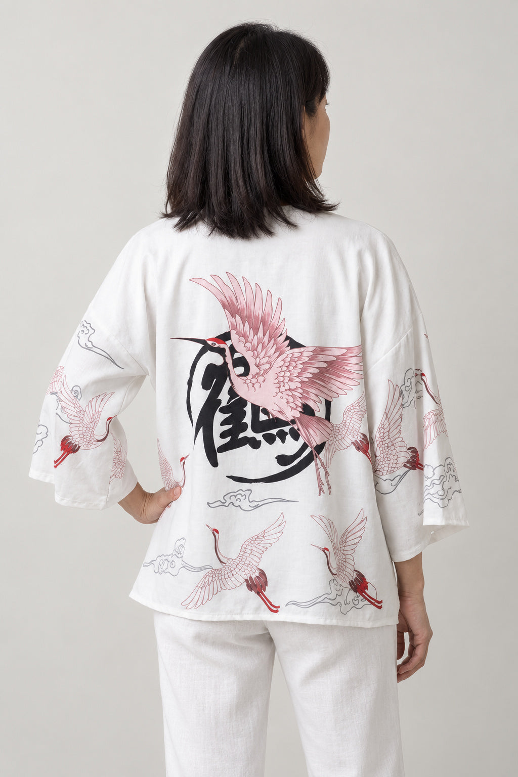 Women's Red Bird Kimono Jacket 'Akane' – back view of white kimono jacket with red crane and crest print
