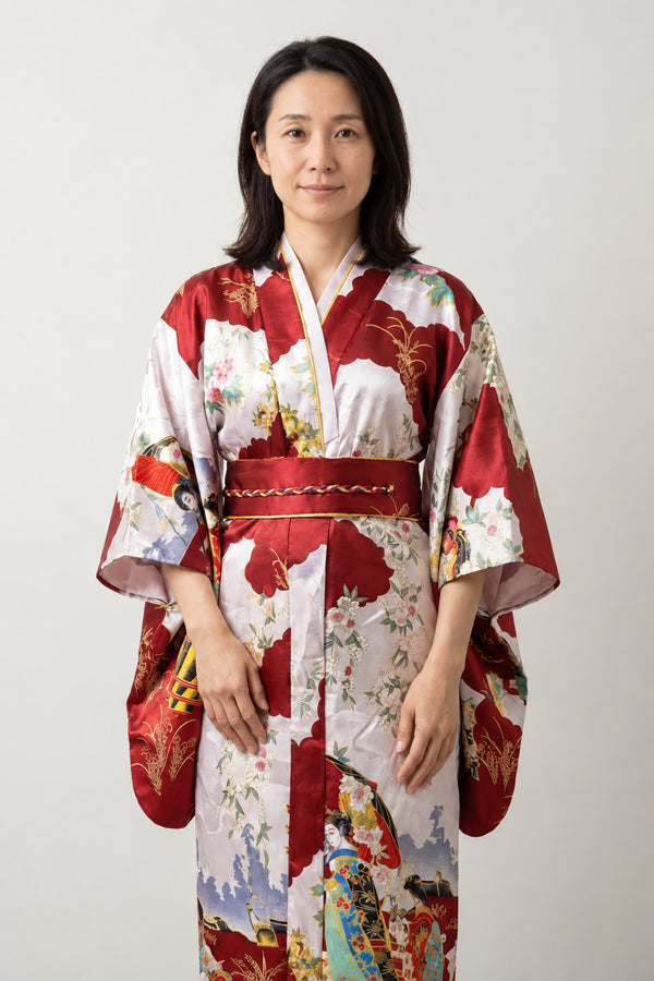 Women's Red Geisha Kimono 'Fugaku' – red women's kimono robe with geisha, Mount Fuji and cherry blossom print and red obi, Japanese satin-look kimono dress, front view on model