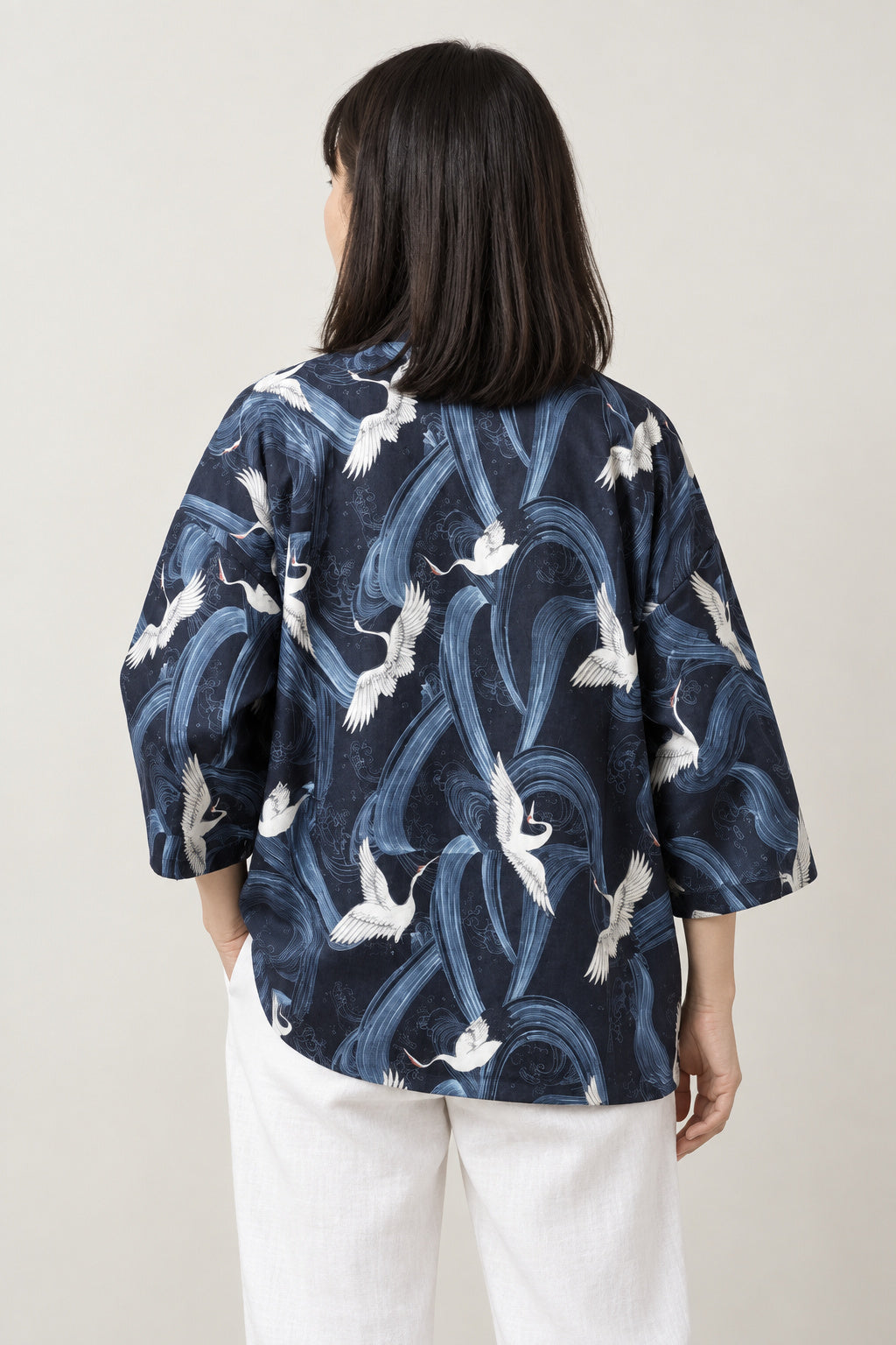 Women's Tonal Navy Kimono Jacket 'Aonami' – back view of navy kimono jacket with tone-on-tone waves and cranes print