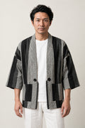 Woven Stripe Kimono Cardigan 'Shimagara' – black and white woven stripe Japanese kimono cardigan with front buttons, unisex haori style jacket, front view on model