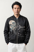 Yokai Crest Bomber Jacket 'Kamon' – black bomber jacket with embroidered dragon crest and blossom, Japanese streetwear, front view on model