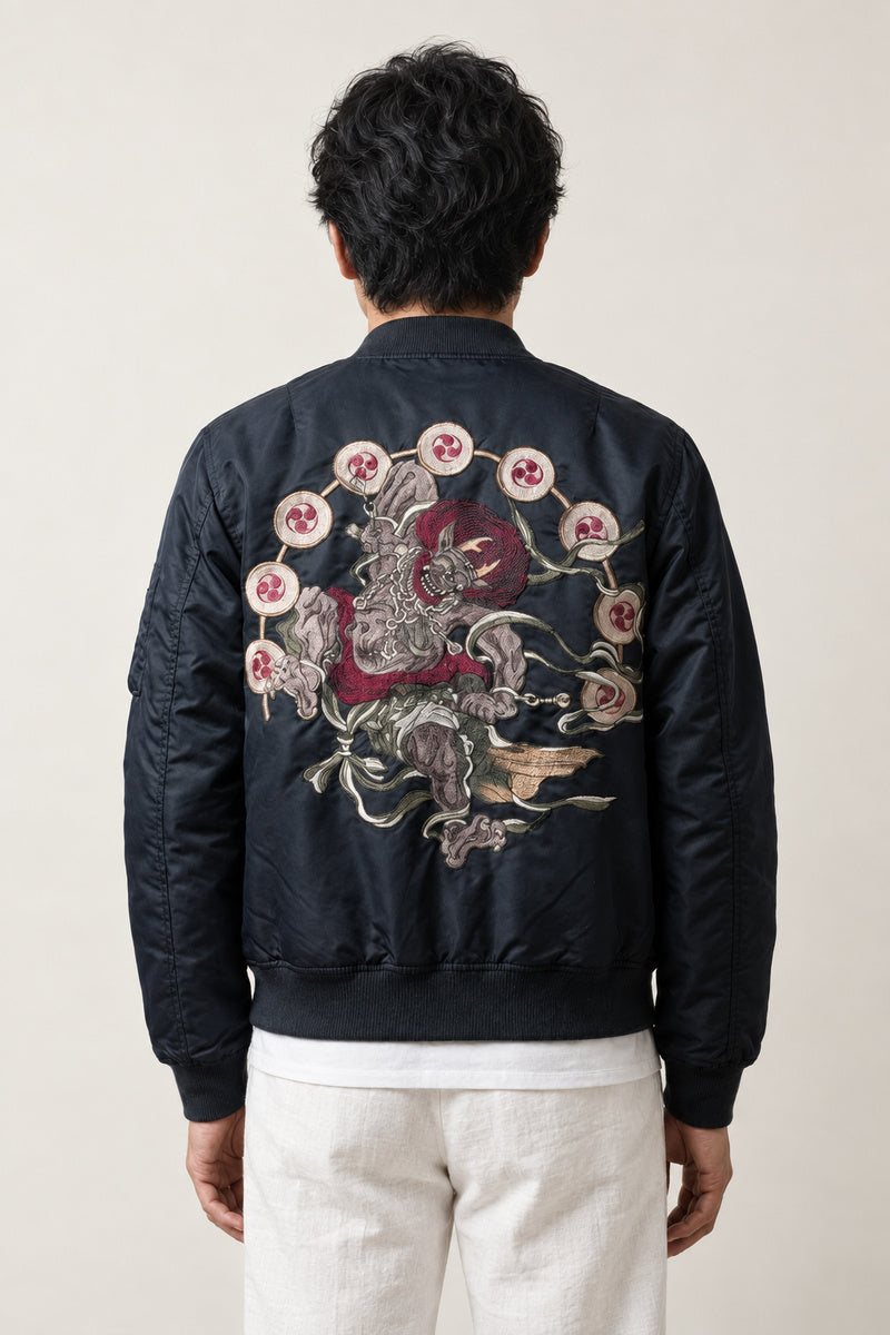 Yokai Crest Bomber Jacket 'Kamon' – back view of black bomber jacket showing the embroidered yokai dragon and chrysanthemums
